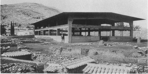 The new protective shelter over the House of the Tiles, with houses of Myloi and Mt Pontinos behind.