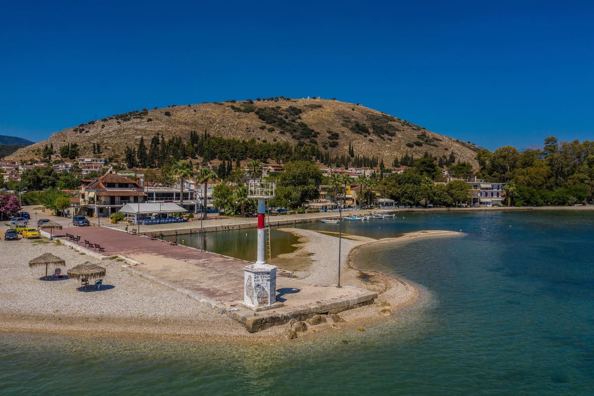 The Myloi pier with its lighthouse, the beach and Pontinos hill seen from the air