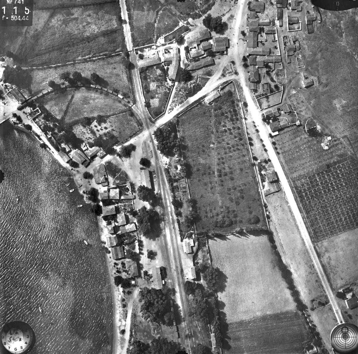 Myloi station, the village, the level crossing and the curved siding to the pier with a long goods train, July 1941
