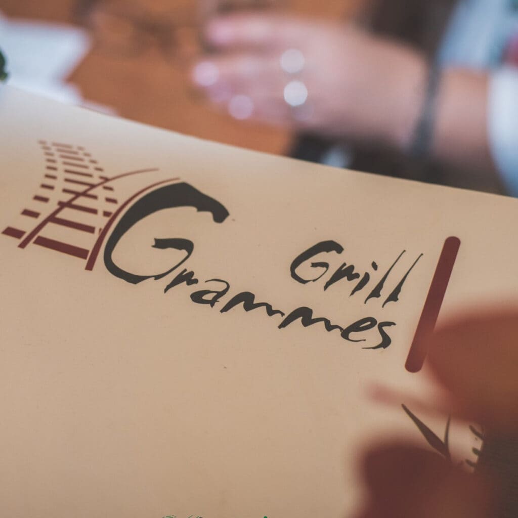 Menu card with the Grill Grammes logo
