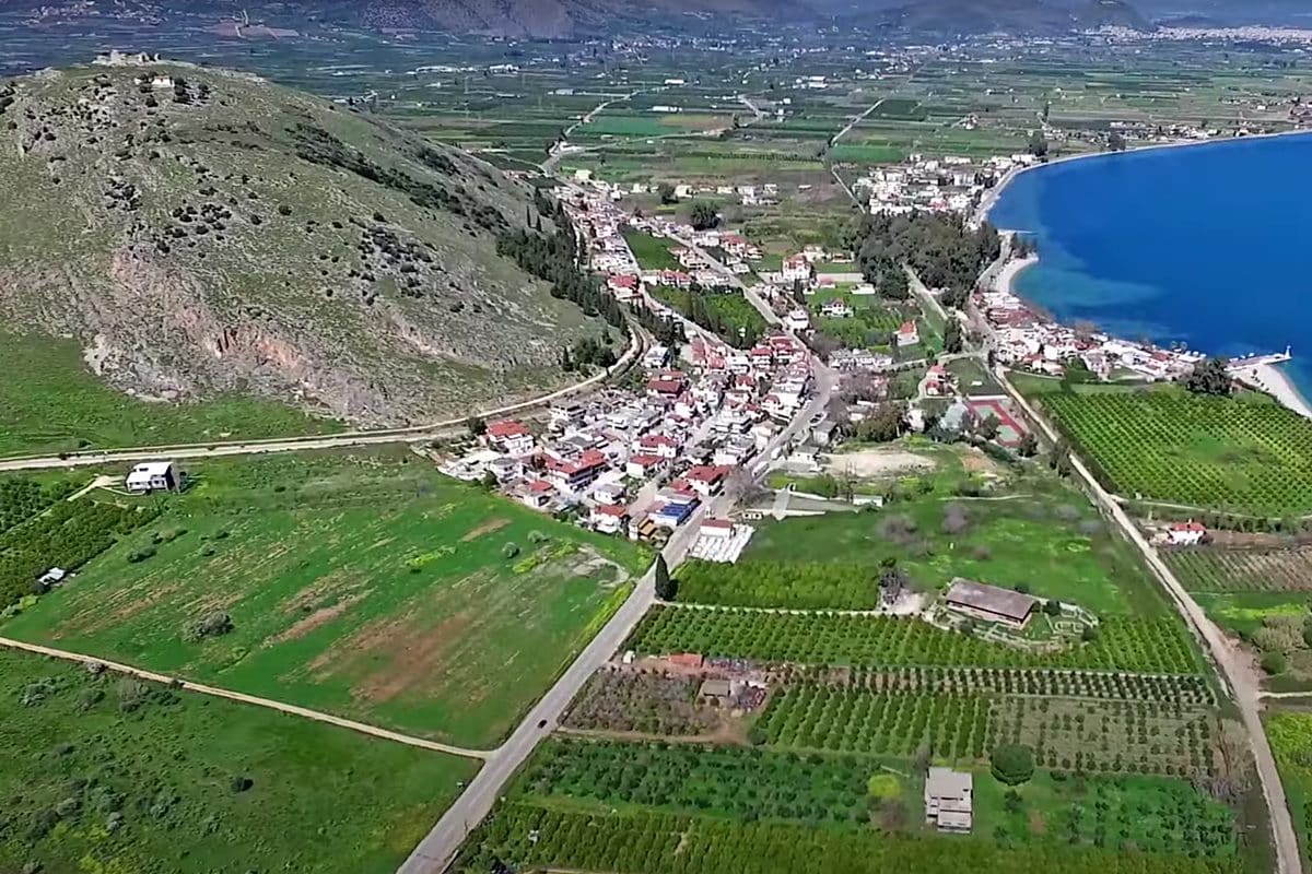 Wide aerial view of Myloi between Pontinos hill, the orchards of the plain and the sea
